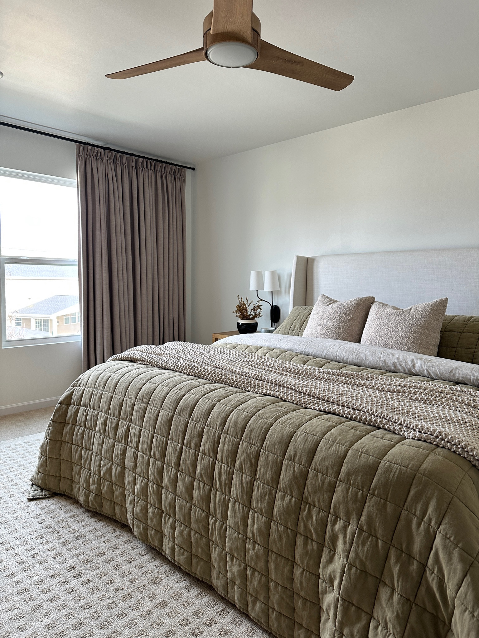 Primary bedroom 
Olive green bedding 
Olive green quilt
Upholstered bed
Neutral rug 

#LTKhome