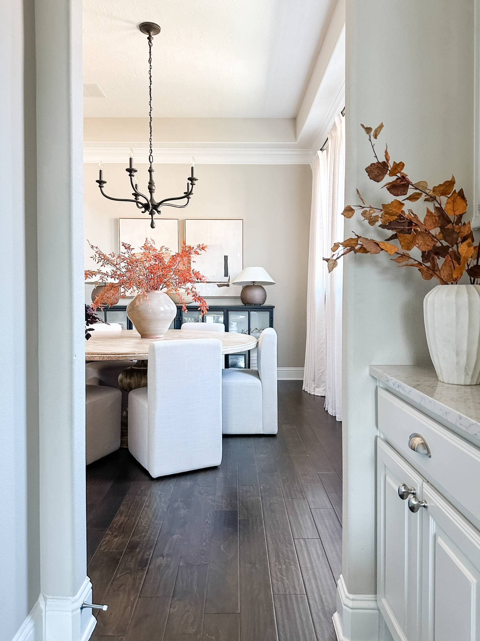Fall views into our dining room. Fall stems, upholstered dining chairs, modern organic decor, neutral decor, abstract wall art. Black chandelier. 

#LTKStyleTip #LTKSeasonal #LTKHome