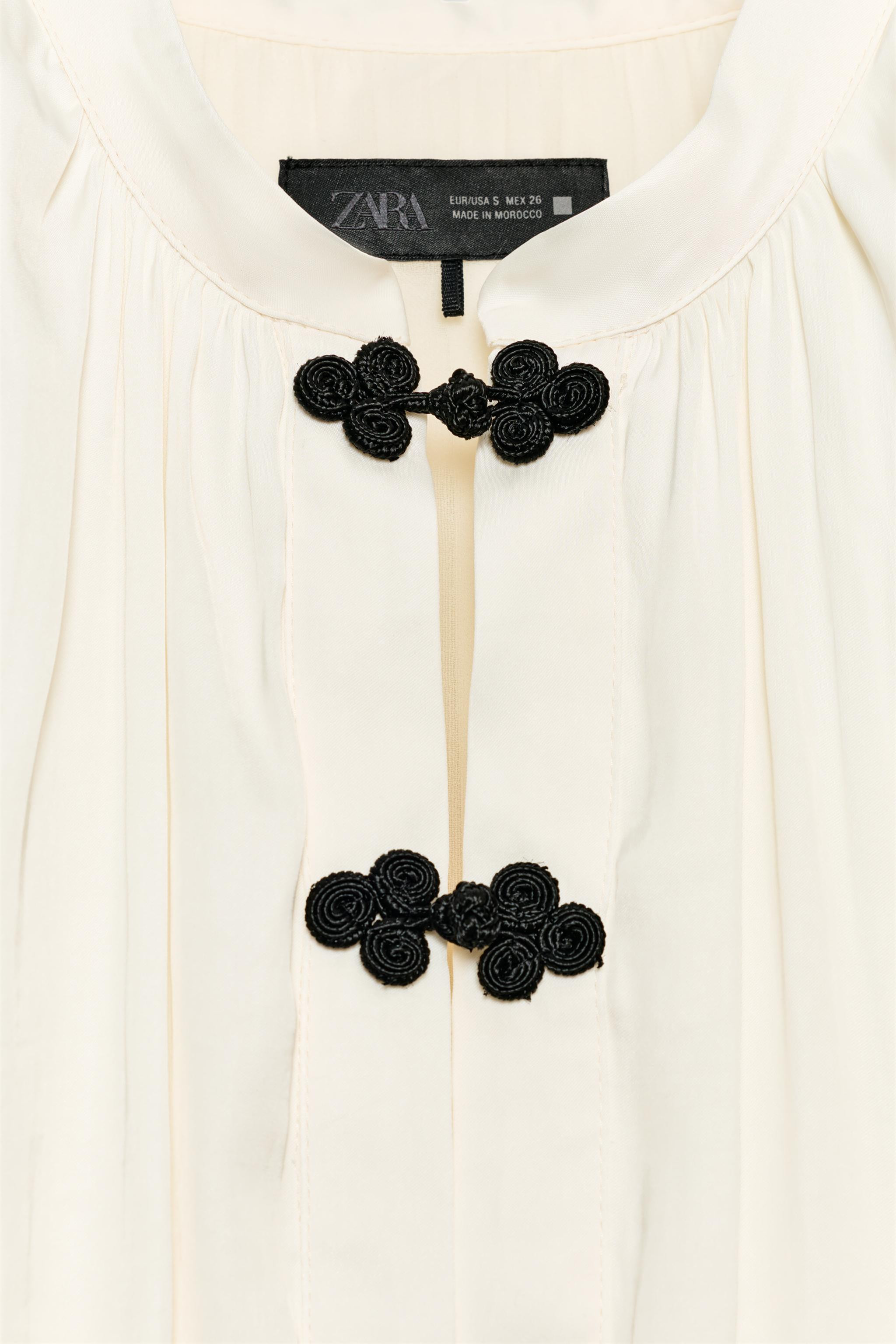 Model height: 178 cmRound neck, sleeveless top with shoulder pads and gathered detail. Featuring ... | Zara UK