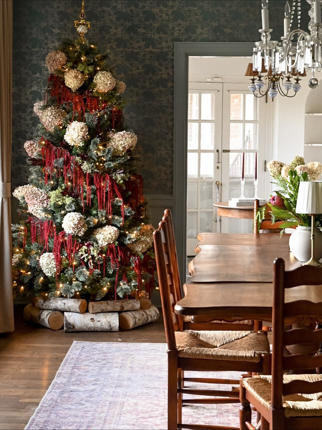 This years hydrangea tree… 
I was really inspired by the way @eyeswoon used amaranth extended out on branches a couple years ago and thought of using it as a garland around the tree.  My hydrangeas looked too stark next to the deep burgundy amaranth so I lightly spray painted them with some pink. I added seeded eucalyptus and some burgundy fall stems from @traderjoes and there you have it! 

I still love the simplicity of last year’s tree (last picture) and I love the drama the amaranth adds this year! 
What do you think? 

#botanicalchristmastree #whimsicaldecor #oldhouselove