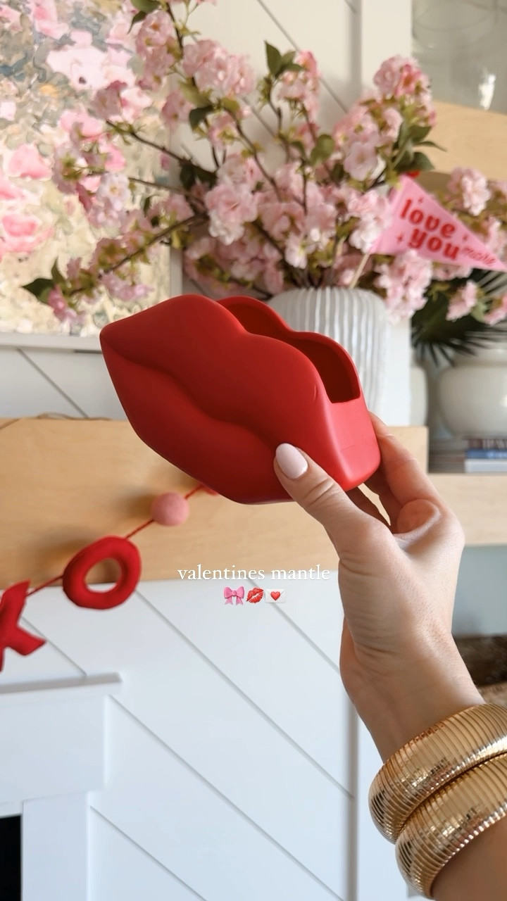 pretty in pink Valentine’s Day mantle 💘 | the @target bullseye section has the cutest little Valentine’s Day items + XOXO banner, add bows to taper candle holders for the sweetest touch 🎀

save + share with a valentine’s lovin’ gal 🫶🏼
shop my faves with @shop.ltk 
#valentinesday #valentinesdecor #vday #galentinesday #target #targetfinds #mantledecor #pinkdecor 

#LTKhome #LTKSeasonal