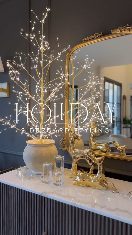 Holiday sideboard styling including these beautiful, affordable gold reindeer from Target and this gorgeous lit tree! I love that the base is this is gold. I unscrewed the bottom to style it in this post - I used styrofoam inside to make it stand up!

#LTKhome #LTKHoliday #LTKfindsunder50