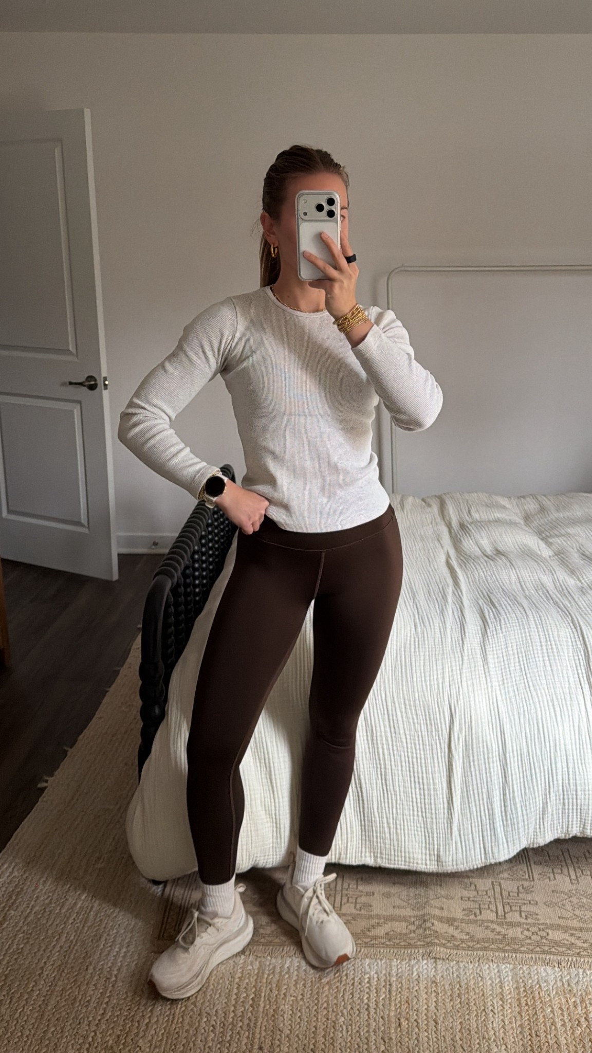 12/6/25 my morning workout outfit, linking my brown Alo leggings (such a flattering, comfy fit), my Garmin watch that I use to track all of my workouts, and my Saucony Tempus sneakers — my go-to running/training shoes that I always recommend.