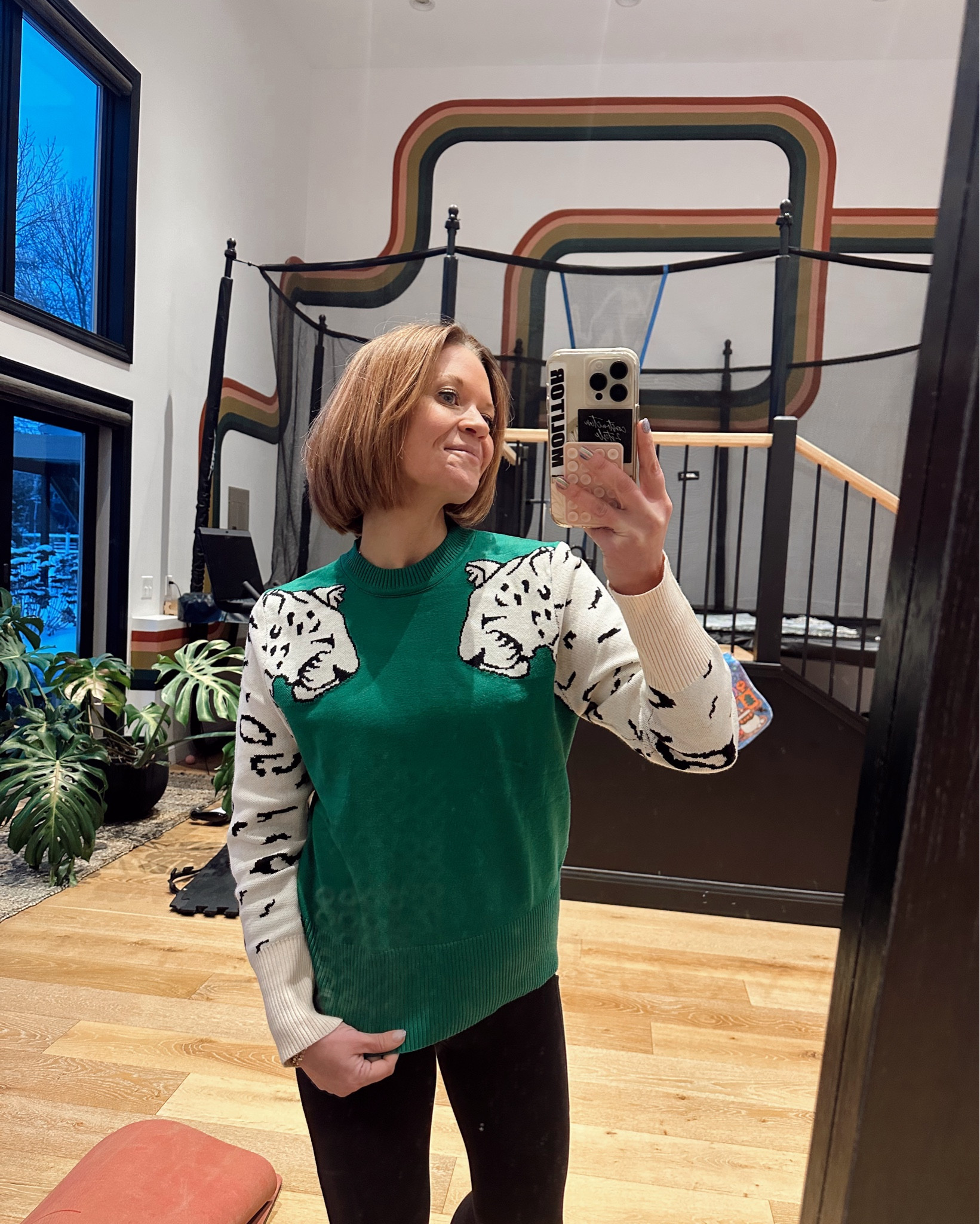 Let’s hear ya roar! Same sweater, comfy with leggings or dress up a bit with white cords. True to size. Wearing small. 