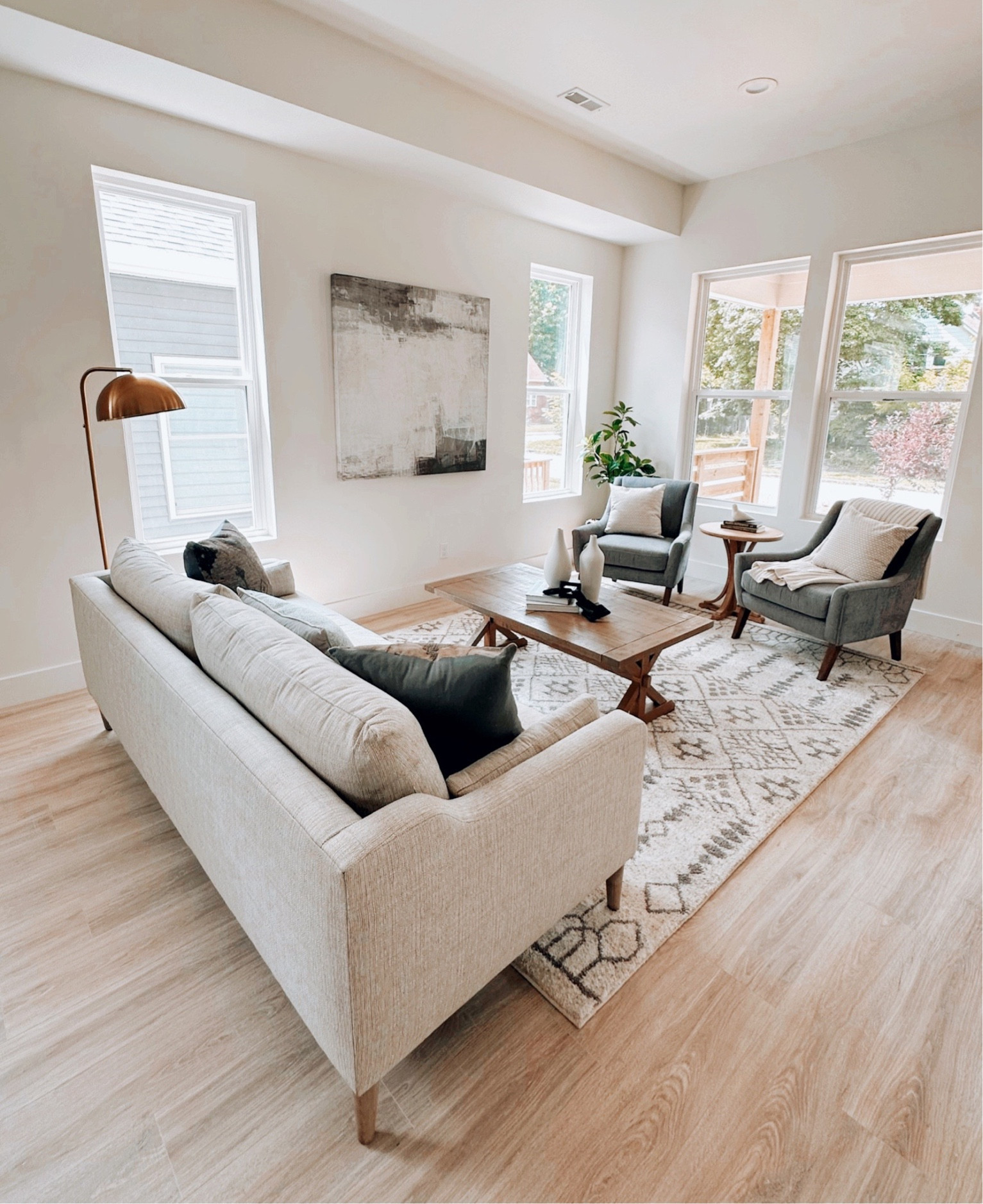 We styled this living space with lots of black, cream and puling some of the color from the cabinets into the upholstery.  This home felt modern with a hint of classic.  

#LTKhome #LTKfamily