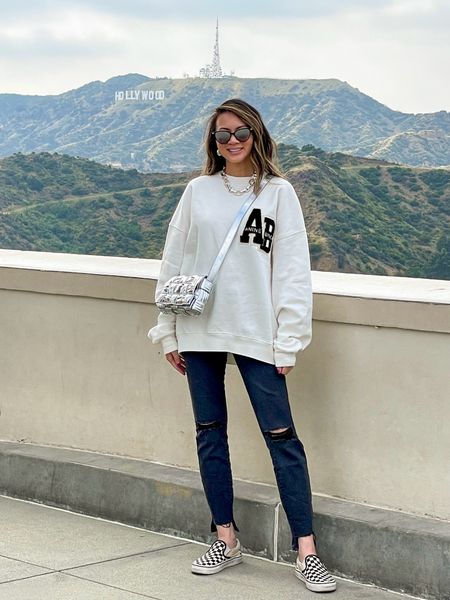 Casual spring outfit 🤍 Love this white letterman sweatshirt. It’s so soft! Just launched in black. Styled with my favorite jeans and most worn pair of sneakers. 

Spring outfit, sweatshirt, jeans, white sneakers, neutral sneakers, Anine Bing, Good American, Vans, crossbody purse, crossbody bag, The Stylizt 




#LTKShoeCrush #LTKSeasonal #LTKStyleTip