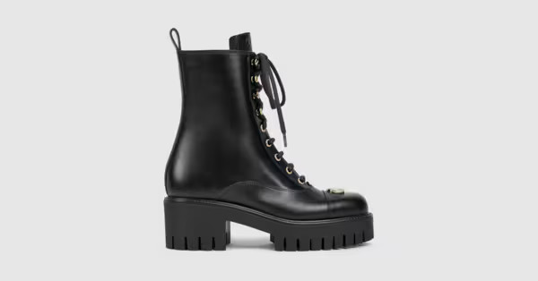 Crafted with a contemporary attitude, this women's lace-up ankle boot features an embossed Gucci ... | Gucci (CA)