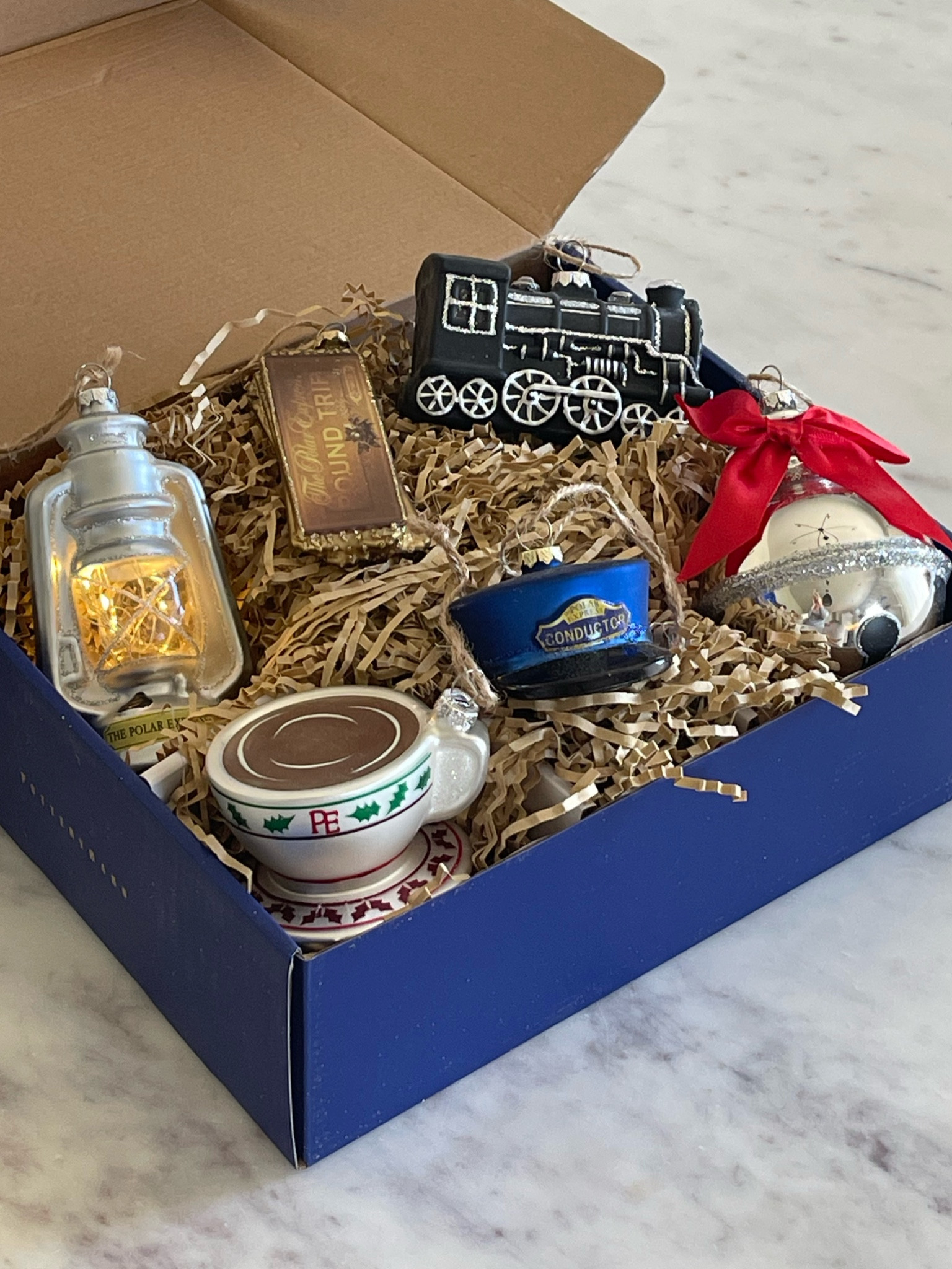 The cutest Christmas ornaments! The 20th anniversary of The Polar Express ornaments. These are beautiful, made of glass and 2 of them light up. 

#LTKFindsUnder100 #LTKHoliday #LTKFamily