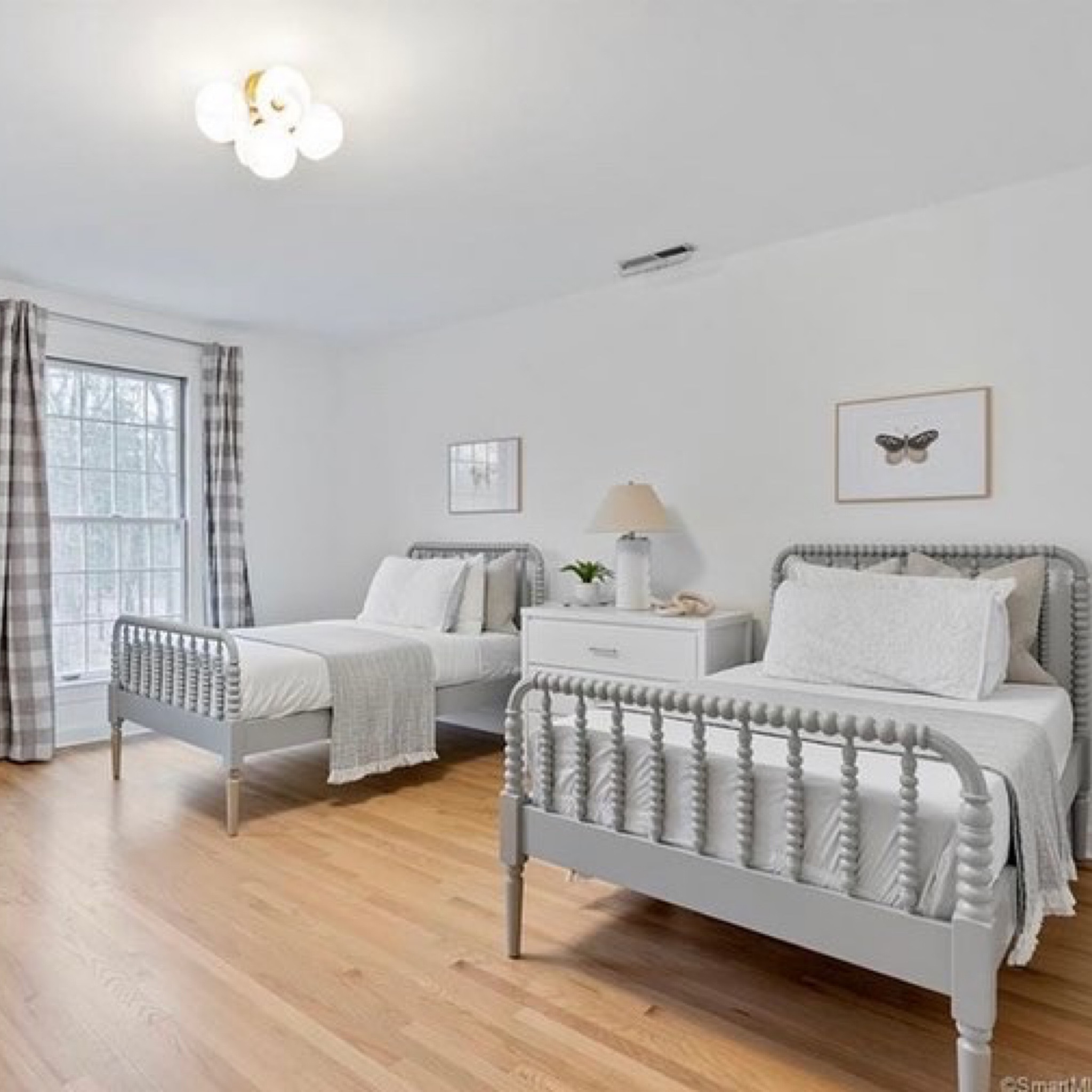 Girls bedroom, gingham curtains, linen, Jenny Lind, crate and barrel, twin bed, neutral room, kids room, light oak floors, butterfly 

#LTKhome #LTKkids #LTKstyletip