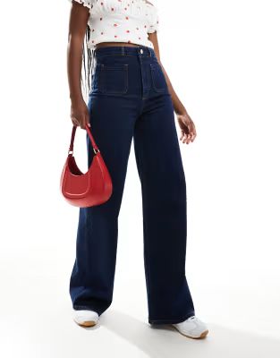 ASOS DESIGN clean wide leg jeans with front pockets in rinse | ASOS (Global)