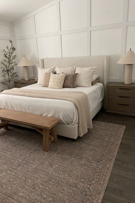 Primary bedroom with neutrals, warm tones, Pottery Barn bench, linen lamp, large nightstands, and a faux olive tree! 

#LTKsalealert #LTKhome