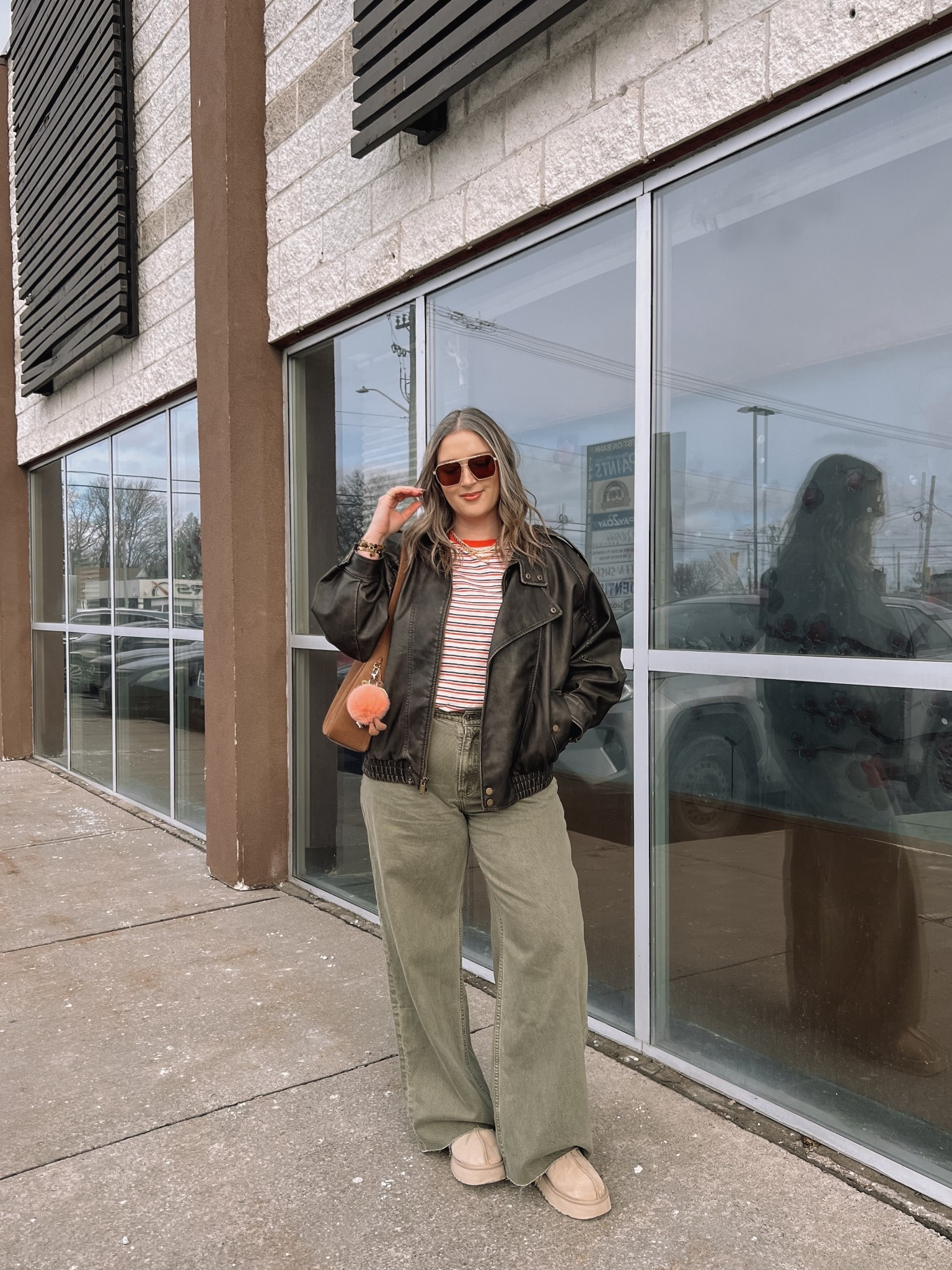 Easy spring outfit! Wearing my usual size L in the leather jacket. Sized up to XL in the striped tee since I have a larger chest and didn’t want it tight. Wearing 32 long in the olive jeans (the long length was a bit too long for me, reg was too short, so I cut the hem for a custom length! Ugg Tazz platforms fit TTS. I wear this coach bag constantly, and the jellycat peach bag charm is so fun for spring!


#LTKjeans #LTKmidsize #LTKstyletip