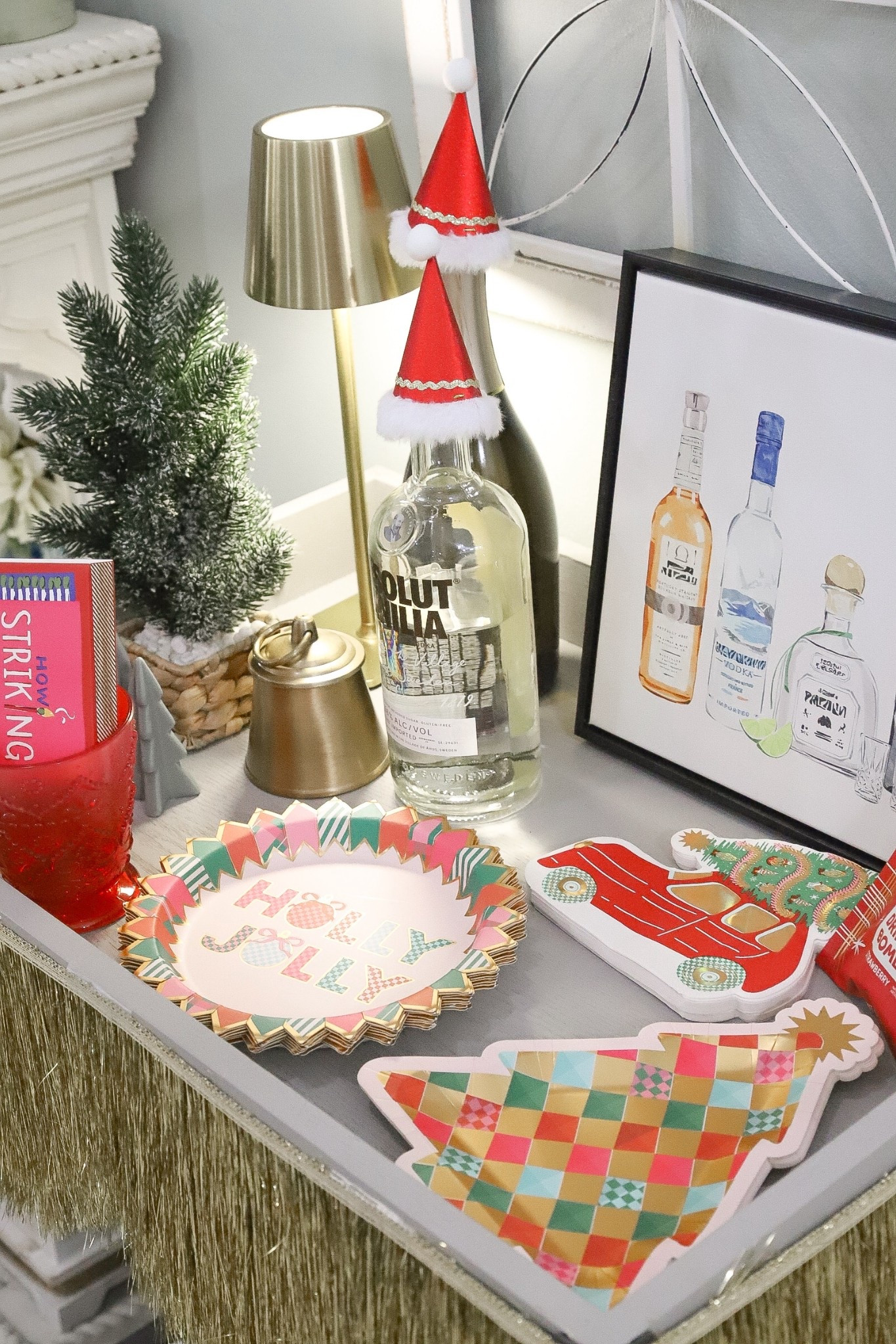 A holly joy bar cart with Packed Party! #ad 

#LTKHome #LTKHoliday #LTKSeasonal