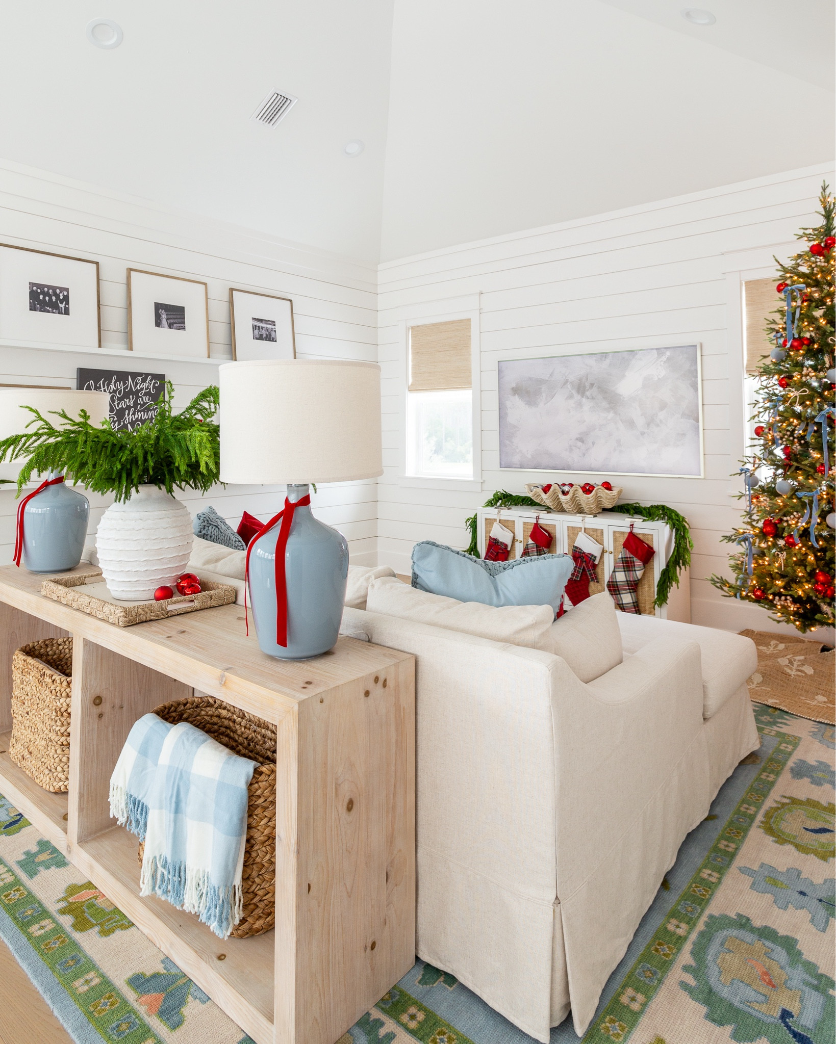 Our coastal loft with white shiplap walls decorated for Christmas with red velvet pillow and light blue knit pillows on our linen sectional, "O Holy Night" art, real-touch Norfolk pine stems in a white terra cotta vase, picture ledge gallery wall frames, and light blue ceramic lamps. See our full Christmas home tour here: https://lifeonvirginiastreet.com/2024-christmas-home-tour/ #ltkholiday #ltkhome #ltksalealert #ltkfindsunder50 #ltkfindsunder100 #ltkstyletip #ltkseasonal 

#LTKHome #LTKSaleAlert #LTKHoliday