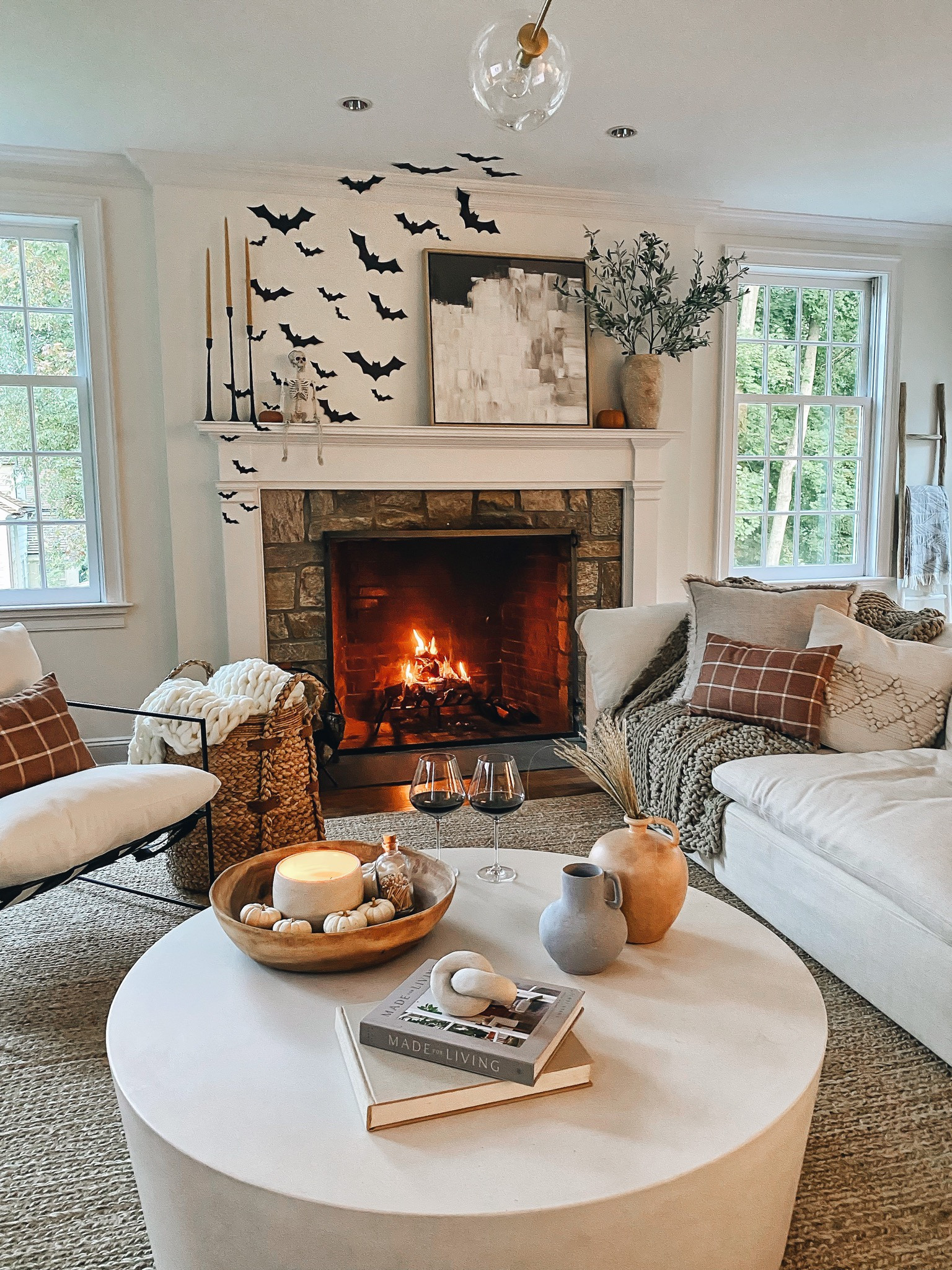 Halloween Home Decor! My exact bats were a Marshall’s find a few years ago that have little rings on the back that I’m able to attach to mini command hooks (never had any issues damaging walls). You can also use painters tape to hang bats! 

-listing living room details below, but couch is Restoration Hardware cloud couch // jute rug is from pottery barn // fireplace screen was left by previous homeowners // decorative throw pillows no longer available 

#LTKHoliday #LTKHalloween #LTKhome