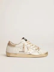 Women’s Super-Star sneakers with gold sparkle foxing and metal stud lettering | THE YES