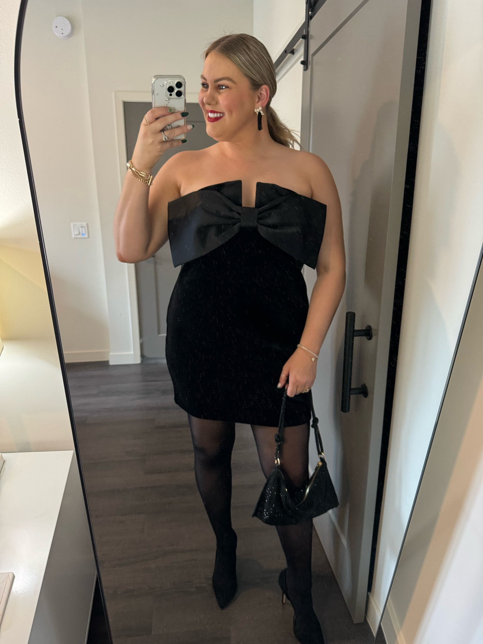 Holiday dress 
Black velvet mini dress with bow detail 
Sparkly rhinestone bag 
Black bow tassel earrings 

#LTKHoliday #LTKSeasonal #LTKstyletip