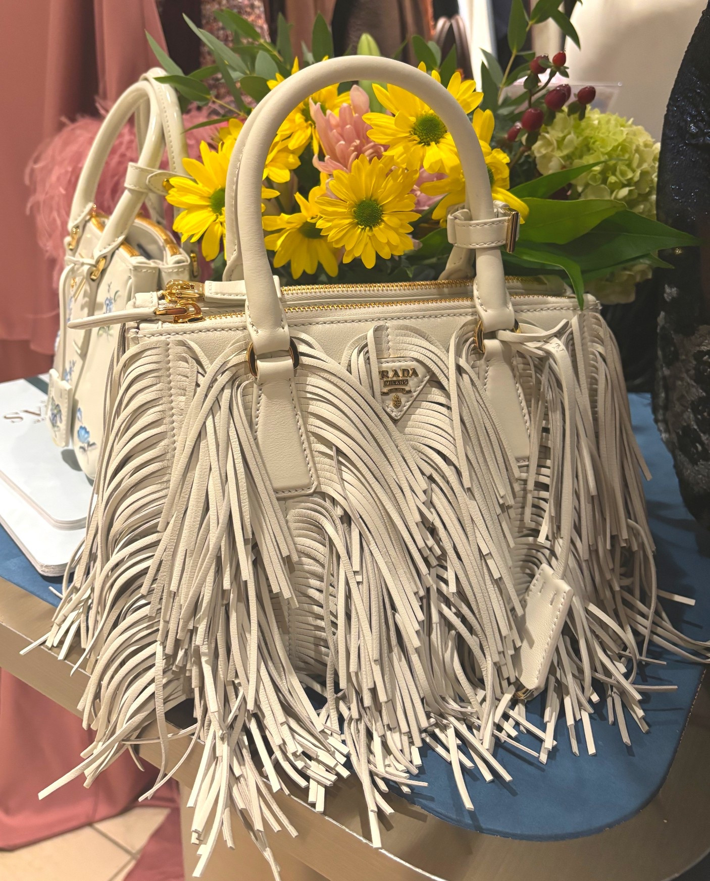 Fringe! A fall trend we are seeing everywhere this season. On bags, skirts and coats. This Prada top handle bag is perfect. #prada #pradabag #fringe #fringeisin #fringebag 

#LTKItBag #LTKSeasonal #LTKStyleTip