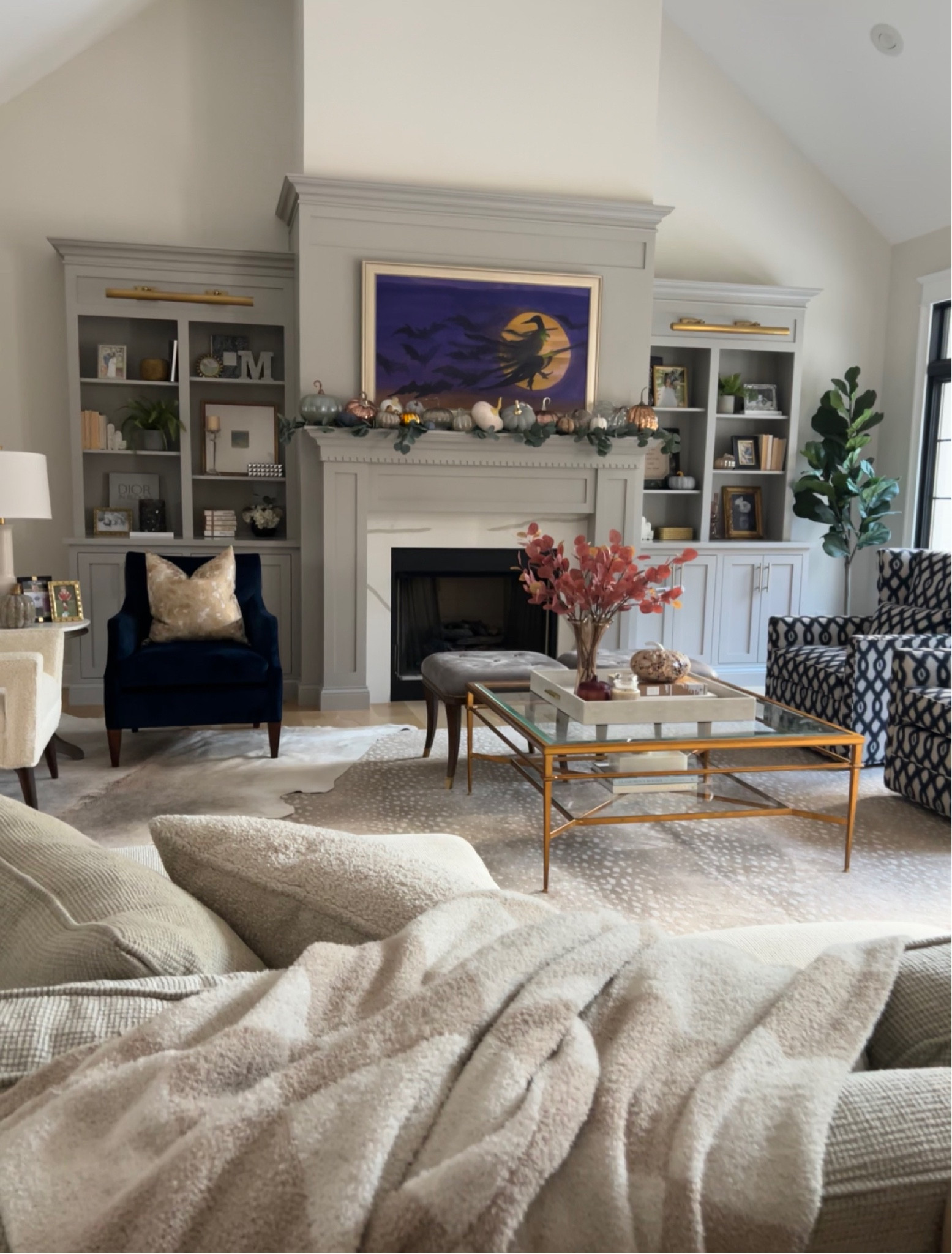 Living room decor, neutral fall design inspo, built in bookshelves, cabinet lighting, area rug 

#LTKHalloween 

#LTKhome #LTKSeasonal