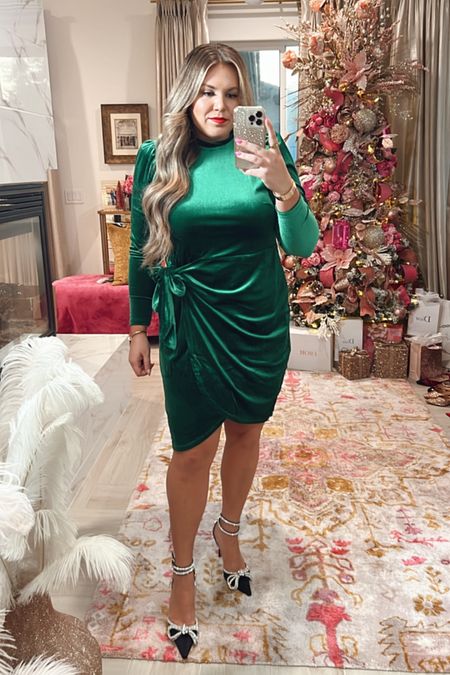 curvy emerald green velvet faux wrap dress for the Holidays! wearing size 14 and linking my exact black bow heels! 

#LTKcurves #LTKsalealert #LTKHoliday