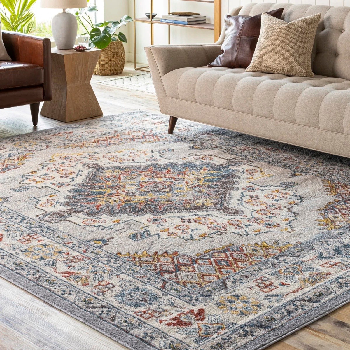 This gray oriental area rug from Wayfair adds the perfect mix of vintage charm and modern warmth to any living space 🏡✨ Featuring intricate patterns with subtle pops of color, it instantly elevates your living room while tying all your furniture together. Styled with a neutral sofa, accent chair, and wood side table for a cozy, layered look. 🛋️ Currently part of the 5 Days of Deals with 76% off, making it an amazing steal. 