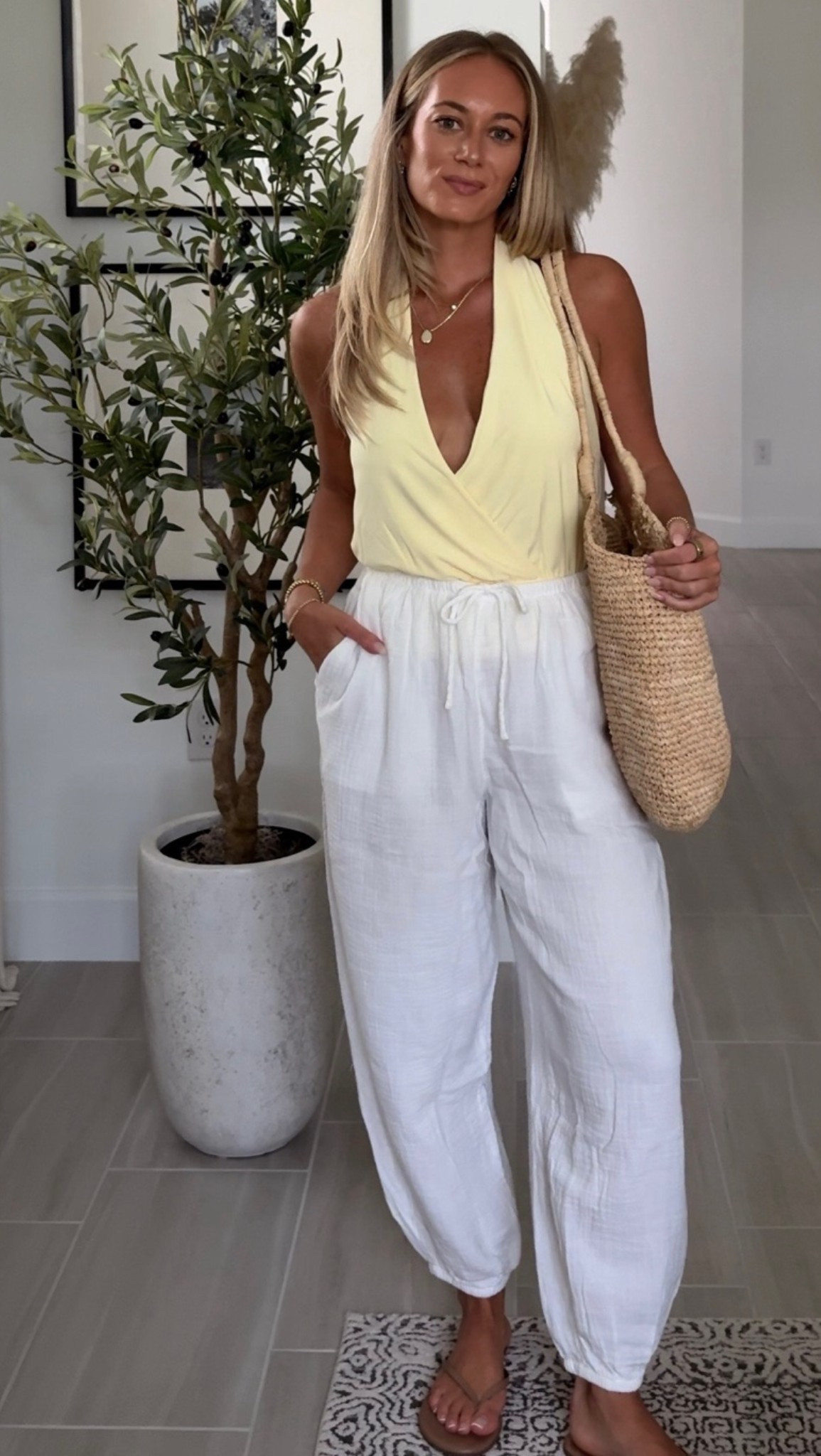 Styling my latest @Aritzia  haul, this butter yellow halter with linen balloon pants and a straw bag is perfection!

Wearing S in both

linen pants, balloon pants, halter top, yellow halter, straw bag, summer outfit, Aritzia outfit, elevated essentials, resort wear, vacation outfit, spring outfit, outfit inspo

#LTKootd #LTKSeasonal #LTKTravel