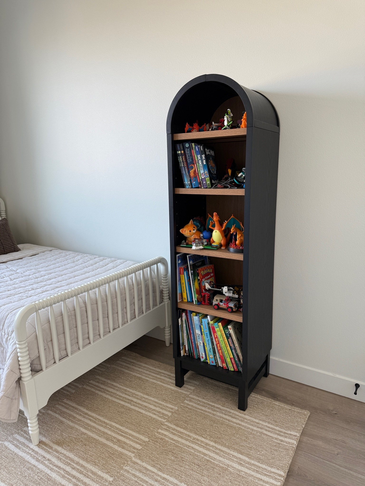 This narrow arch bookcase from Walmart is on sale! The black is rarely in stock. Perfect size to hold toys, books, etc.