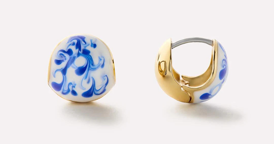 Simple yet unique, these statement earrings plated in 14k gold feature a spherical design and han... | Ana Luisa