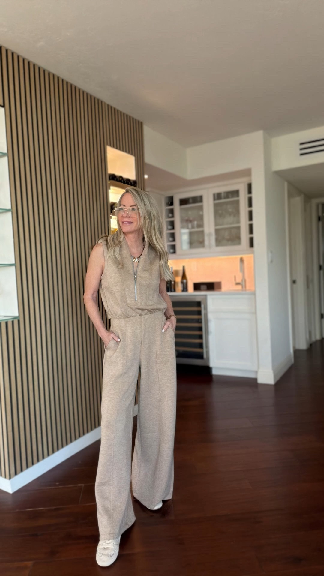 My favorite kind of outfit — polished but unbelievably comfortable. This Spanx AirEssentials jumpsuit drapes beautifully, is lightweight, and the wide leg is very flattering (especially if you’re petite like me). The best feature? The back opens so you don’t have to completely undress in a restroom 🙌 Practical AND chic. Perfect for travel, errands, or casual dinners. I styled it with neutral sneakers and simple gold jewelry for an effortless everyday look.

#LTKTravel #LTKActive #LTKOver40