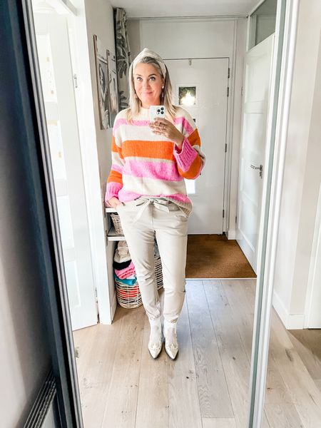 Outfits of the week. 

A lovely soft and warm striped sweater in beautiful orange, pink and beige tones paired with a pair of beige faux leather paperbag pants (https://www.linkmaker.io/by3VcMB90) and beige western boots. 



#LTKeurope #LTKunder50 #LTKSeasonal