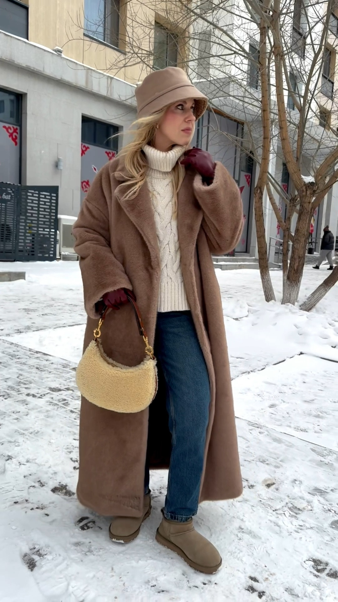 Camel beige fur coat, shearling fur bucket hat, cable knit sweater, Zara mom jeans, Ugg ultra mini boots, shearling handbag 

#LTKSeasonal #LTKOver40 #LTKSaleAlert
