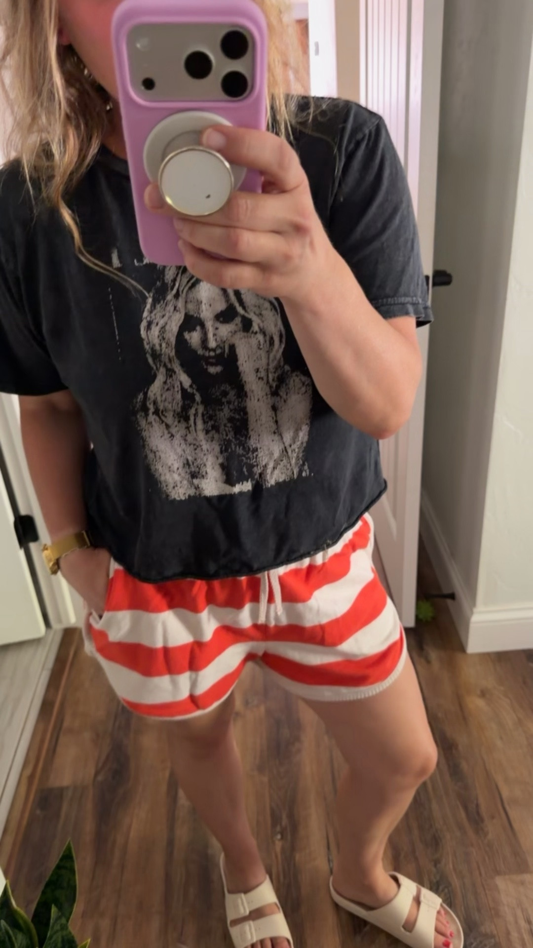 LTK outfit details 🤍🧡

Sharing all the links for this casual summer outfit! These orange and cream striped terry shorts are incredibly soft and comfy and come as a matching set with a lightweight long sleeve button-front top (it’s still on the way, but I linked it too!).

Also linking my favorite Freedom Moses sandals—I’ve worn these for years and they’re absolutely worth the investment. They’re waterproof, lightweight, and perfect for the pool, beach, vacations, and everyday summer outfits.

And if you’ve been asking about my watch, it’s my GOLD Steps watch! It’s waterproof, so I never have to take it off to swim.

The Britney Spears tee is sadly no longer available. 😂

Keywords: matching lounge set, terry cloth set, striped shorts, summer lounge outfit, casual mom style, comfy summer outfit, pool outfit, beach vacation outfit, waterproof sandals, Freedom Moses sandals, waterproof watch, Midwest summer style.

#LTKootd #LTKmomlife #LTKOver40
