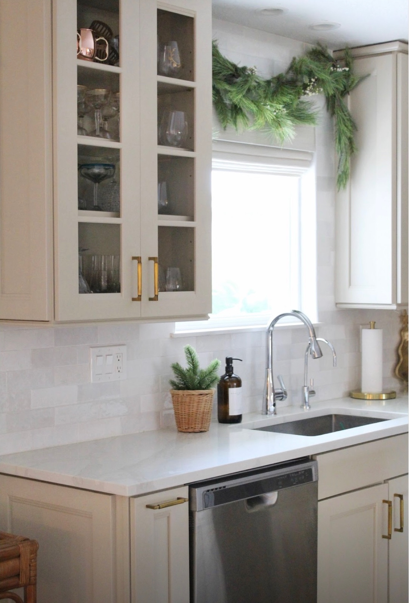 Christmas kitchen 
Tile backsplash garland touchless faucet hardware cabinet pulls 

#LTKFindsUnder100 #LTKHome