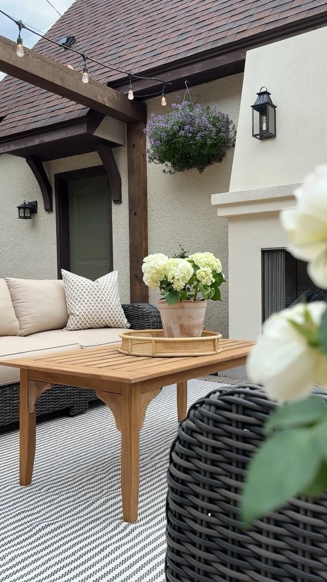 Our pergola isn’t done yet, but thanks to @birchlane, our patio is officially ready for summer! Birch Lane offers an updated take on classic style and their outdoor products can be used season after season. Linking my soft closing teak wood deck box, teak wood coffee table, wicker tray, outdoor/indoor pinstripe rug and pillows - all from Birch Lane. #BirchLanePartner #MyBirchLane

#LTKStyleTip #LTKHome