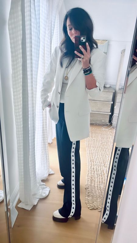 Track pants and an oversize blazer is sporty for the weekend but slightly professional to work in 

Active 
Work 
Ootd 

#LTKActive #LTKworkwear #LTKstyletip