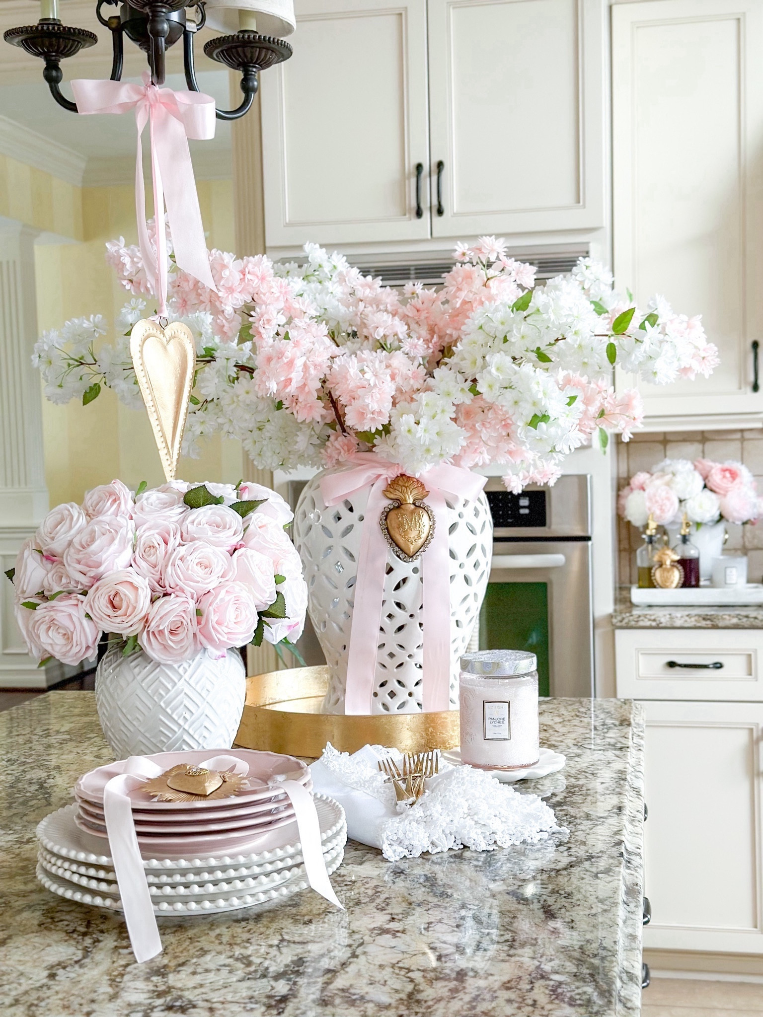Valentine’s Day kitchen decor

Cherry blossom stems, pink decor, white ginger jar, valentines decor, sacred hearts, gold hearts, faux flowers, pink roses, white plates, Pink plates, white napkins, gold flatware, pink candle, Voluspa, ring vase, designer look for less, gold tray, kitchen accessories, marble tray

#LTKhome #LTKSeasonal #LTKGiftGuide