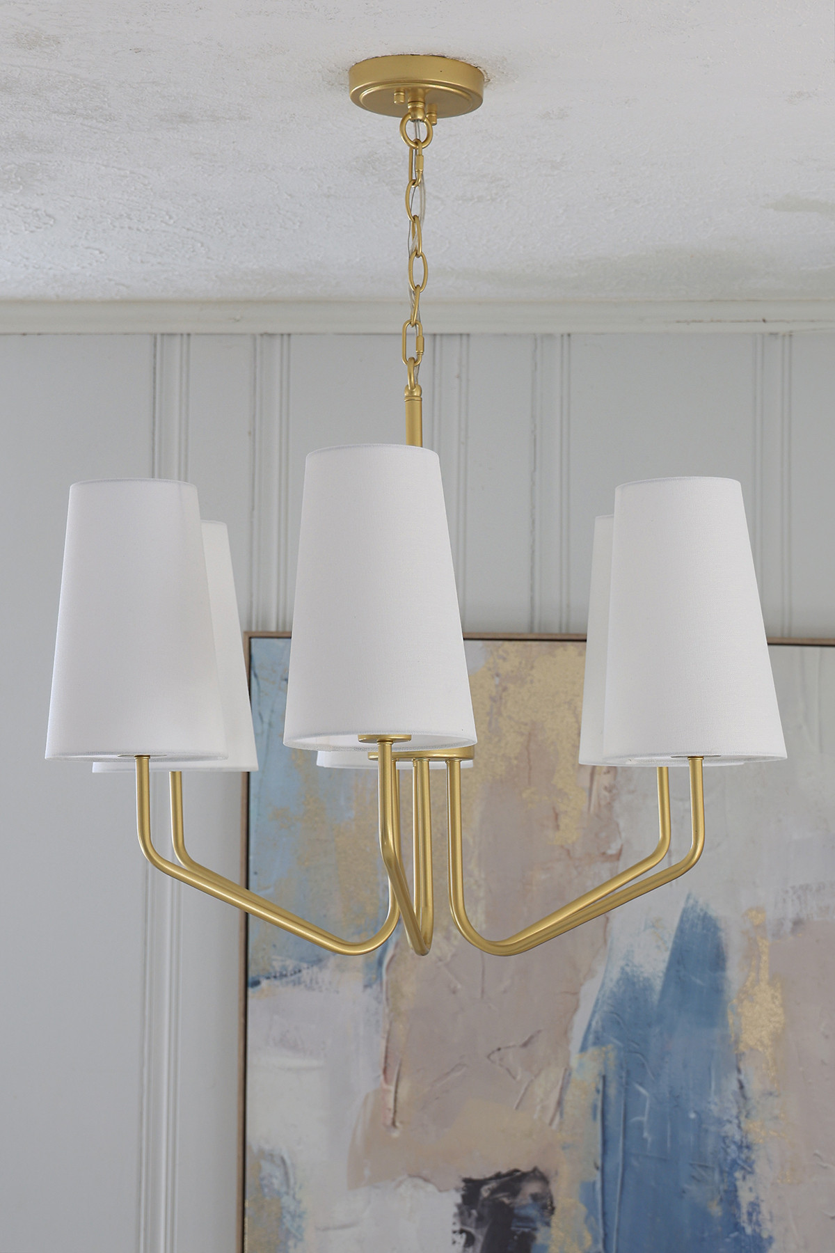 Dining room chandelier light fixture | Gold sprayed fixture with white linen shades 

 #LTKHome