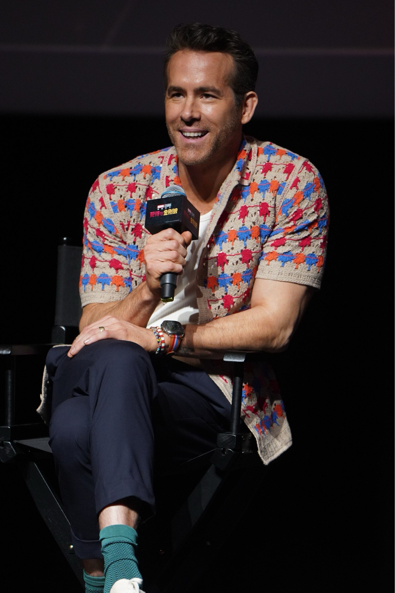 Ryan Reynolds in Shanghai promoting Deadpool & Wolverine wearing a med-ready crochet shirt, pleated drawstring pants, and low top converse  
