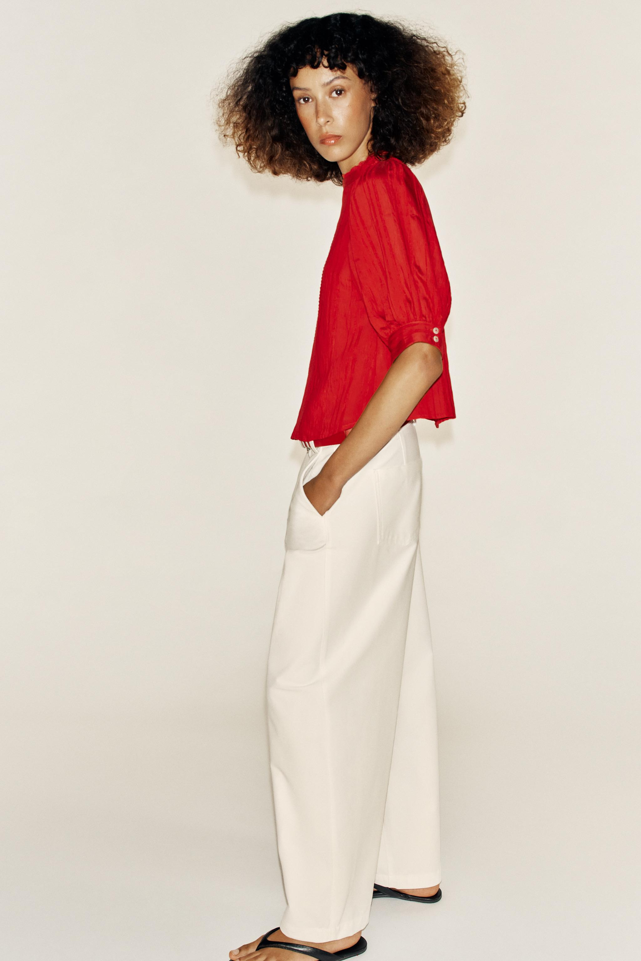 High-neck shirt with short puffed sleeves. Features matching lace trim details. Back closure with... | Zara US