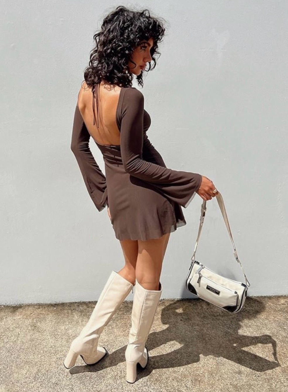 City chic meets western country concert outfit. ✨ This long sleeve mini dress is easy to style with cowboy boots, a statement belt, layered jewelry, or bold accessories depending on the look you want. 

Perfect for summer concert outfits, country concert outfits, Nashville trips, date nights, and cute summer dress looks that feel western but still polished. 🤎

#LTKSeasonal #LTKBeauty #LTKSaleAlert