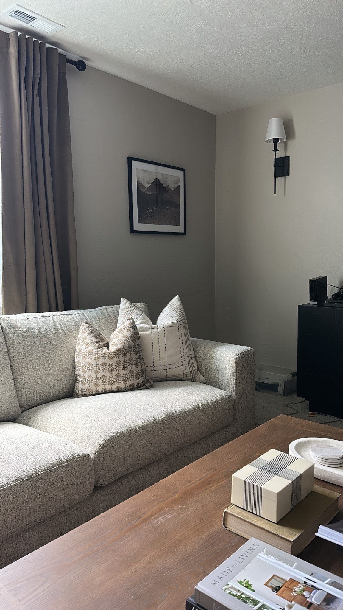 Floral throw pillow
Sectional couch
Basement decor
Basement living room design
