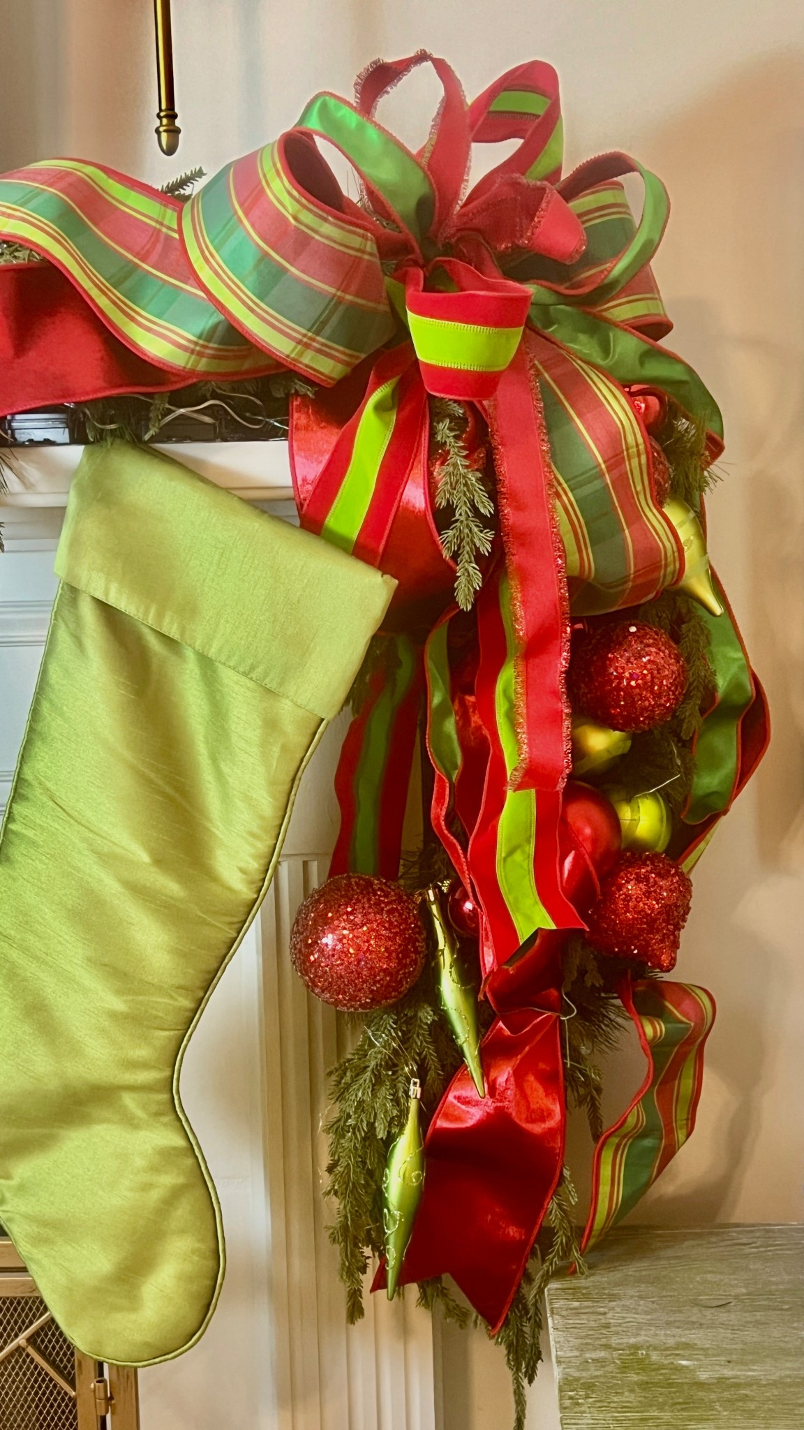 Bringing all the Christmas cheer to the mantel this year with these bold red + green ribbons and my favorite oversized satin stocking. 💚❤️✨
I layered multiple ribbons — velvet, satin, and plaid — to get that full, luxe holiday look, then tucked in greenery and statement ornaments for extra dimension. This color combo is classic but still so fun and cheerful!

Linking similar ribbons, greenery, and extra-large stockings so you can recreate this bright, festive mantel moment in your own home. 🎁🌲


#LTKHoliday #LTKHome #LTKSeasonal