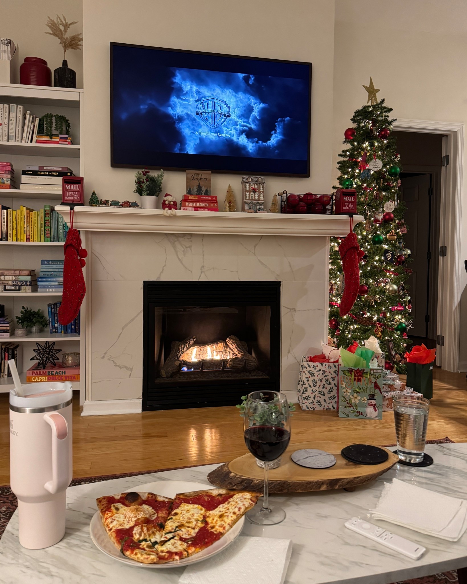 A cozy Christmas night at home. We ordered in pizza and watched Harry Potter. I love our Samsung Frame TV and how it looks during the holidays with the mantel shelf and our slim Christmas tree  

#LTKHome #LTKFindsUnder100 #LTKHoliday