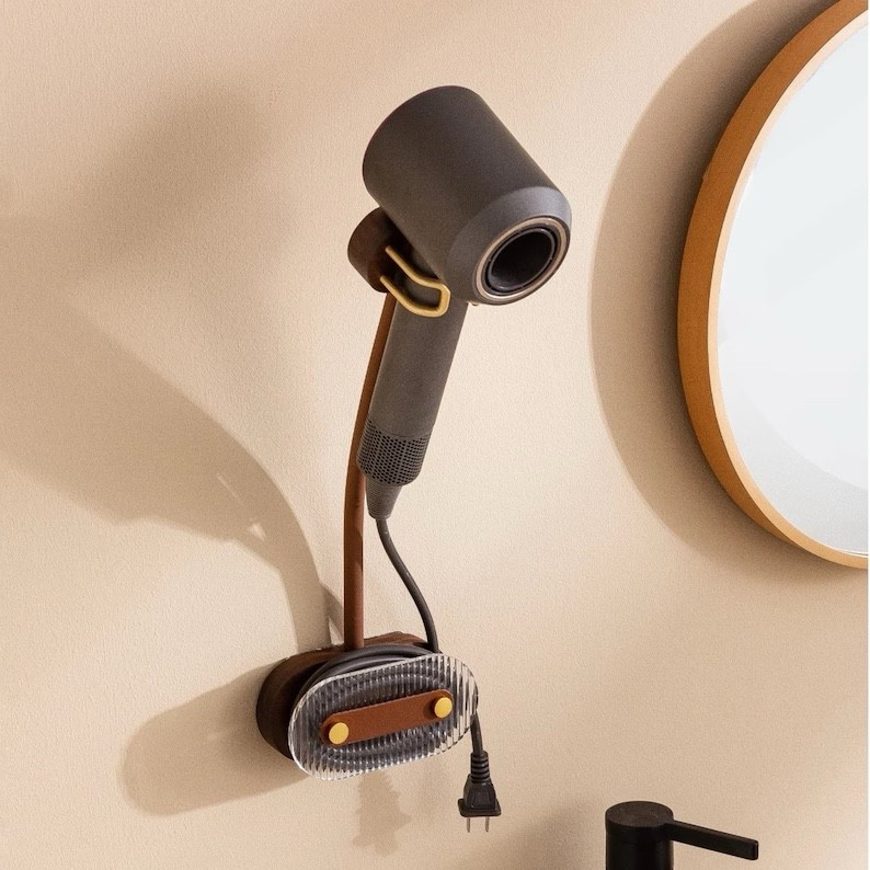 Your sign to upgrade your bathroom organization 🤎
This aesthetic hair-dryer holder keeps everything off the counter, tangle-free, and SO much cleaner looking. Installs in seconds — no drilling!
It’s linked in my LTK — go check it out!

Hashtags:
#BathroomFinds #HomeOrganization #AmazonBathroomFinds #SmallBathroomHacks #HomeMustHaves #BathroomMakeover #OrganizationInspo #LTKHome #LTKFinds #LTKSaleAlert #LTKOnly #HomeEssentials #BathroomStorage #HomeDecorLover #ViralHomeFinds #MinimalHomeStyle
