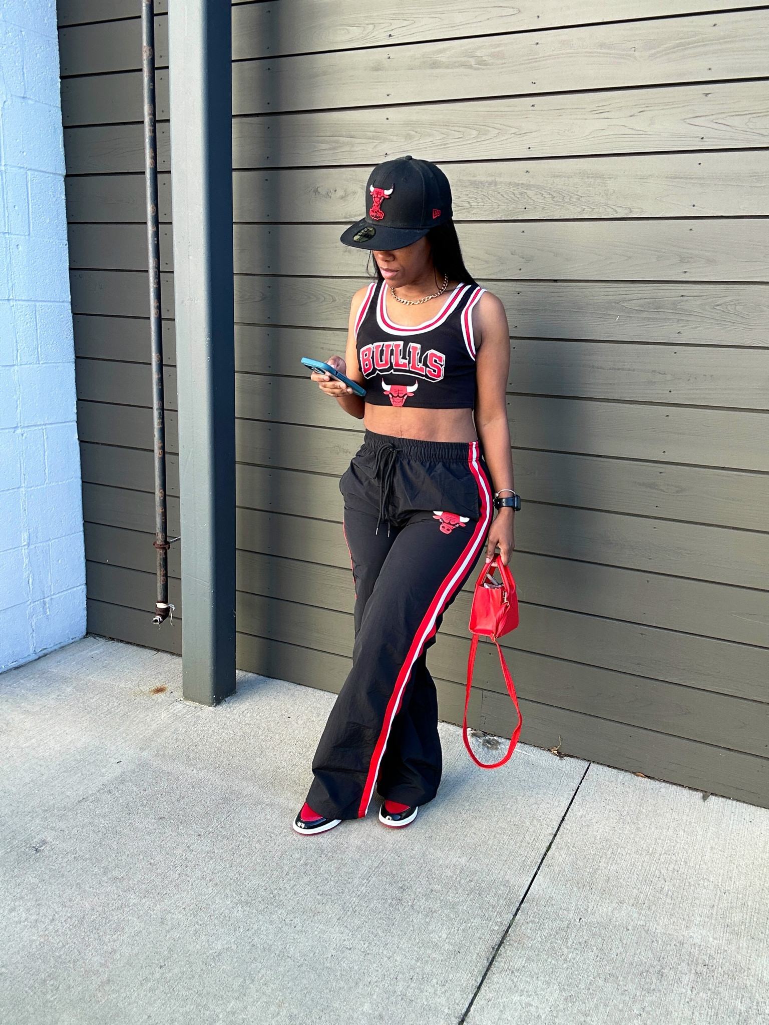 Jordan 1 Patent Bred Casual Outfit Idea. I’m wearing a size small in the varsity striped crop top, size canal in the windbreaker pants. I styled this outfit with a black Chicago fitted hat and a red mini crossbody bag.

#LTKstyletip #LTKshoecrush #LTKSeasonal