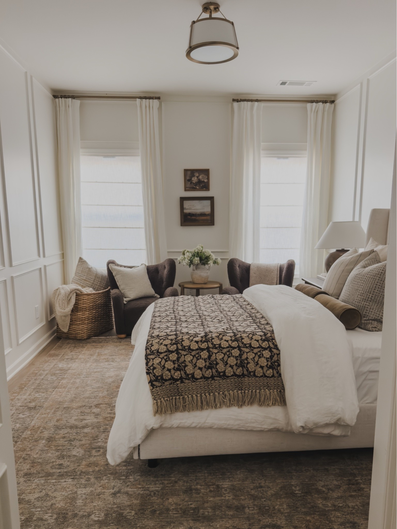 Cozy guest room view with a pop of moody vibes! Still so obsessed with the warmth of this space combined with this stunning variation of my favorite Molly rug and creamy neutral details.

Home finds, neutral home inspo, collected style, bedroom refresh, guest bedroom vibes, moody style, furniture favorites, accent chair, linen curtain, linen shades, linen upholstered bed, vintage style area rug, table lamp, cozy throw pillow, accent table, Wayfair, Etsy, found it on Amazon, Four Hands, nightstand details, shop the look!

#LTKSeasonal #LTKHome