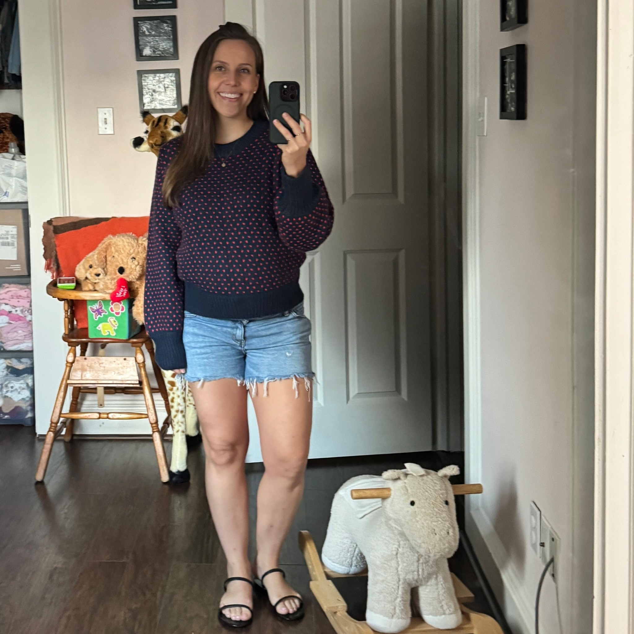 Such a fun heart sweater. So comfy and cozy. Still warm here so paired with shorts and sandals but would go great with jeans. wearing a size medium in sweater  

#LTKBump #LTKPetite #LTKSeasonal