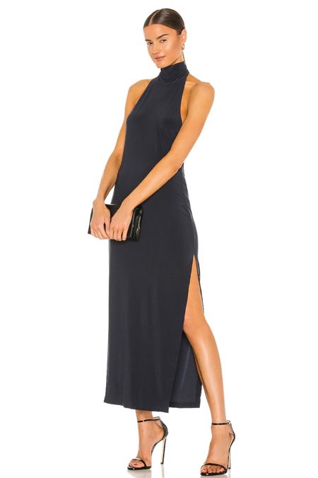 This formal black dress with a slit and a halter neck is classy and sexy! Perfect black tie wedding guest dress or destination wedding guest dress

#LTKwedding