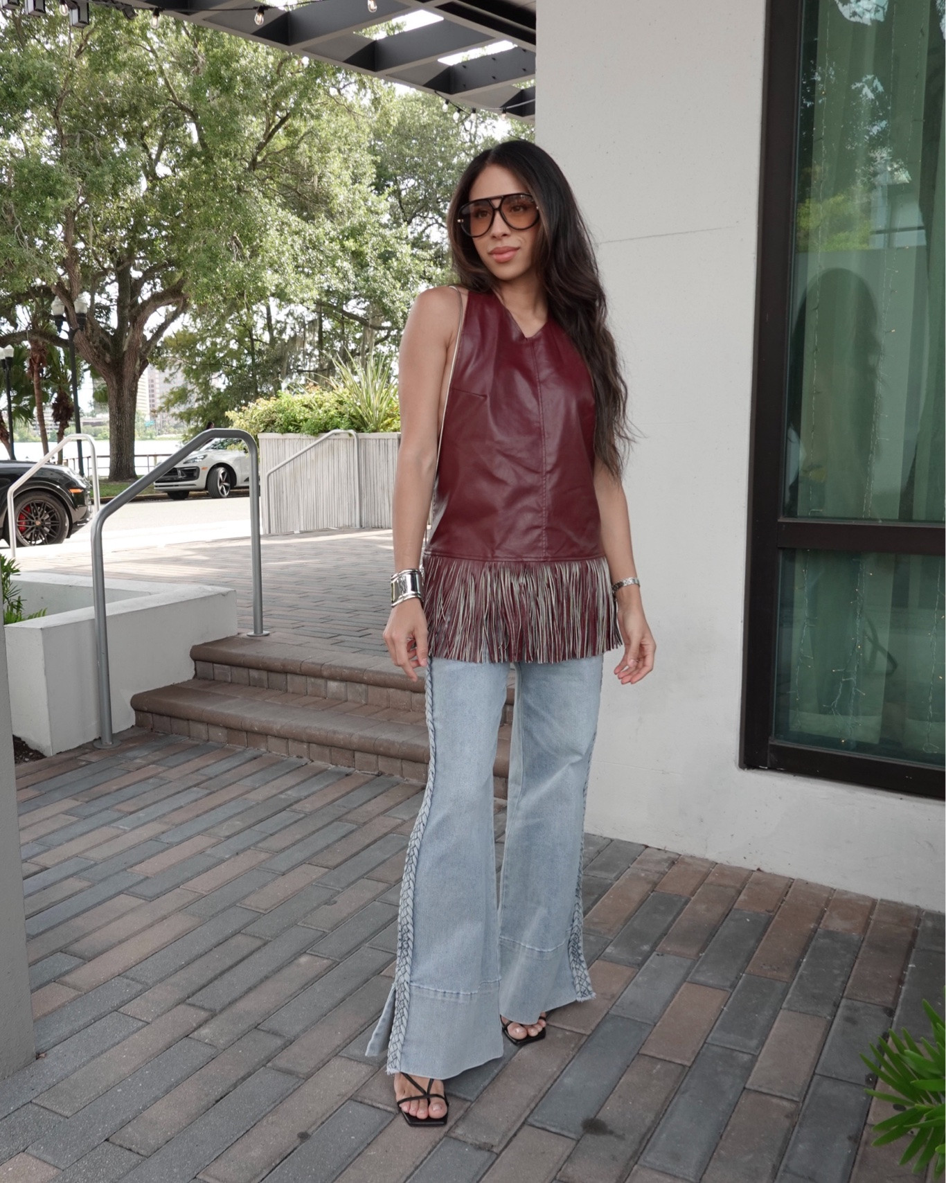 The burgundy faux-leather fringe top is the star — styled with 70s flares and strappy heels for date night. 
#datenight #fringe

#LTKgrwm #LTKootd
