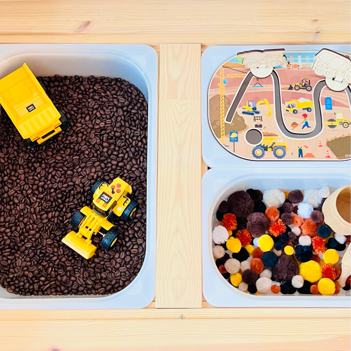 Construction-themed sensory play with coffee beans and Pom poms. The insert is from The Creative Learning Co  